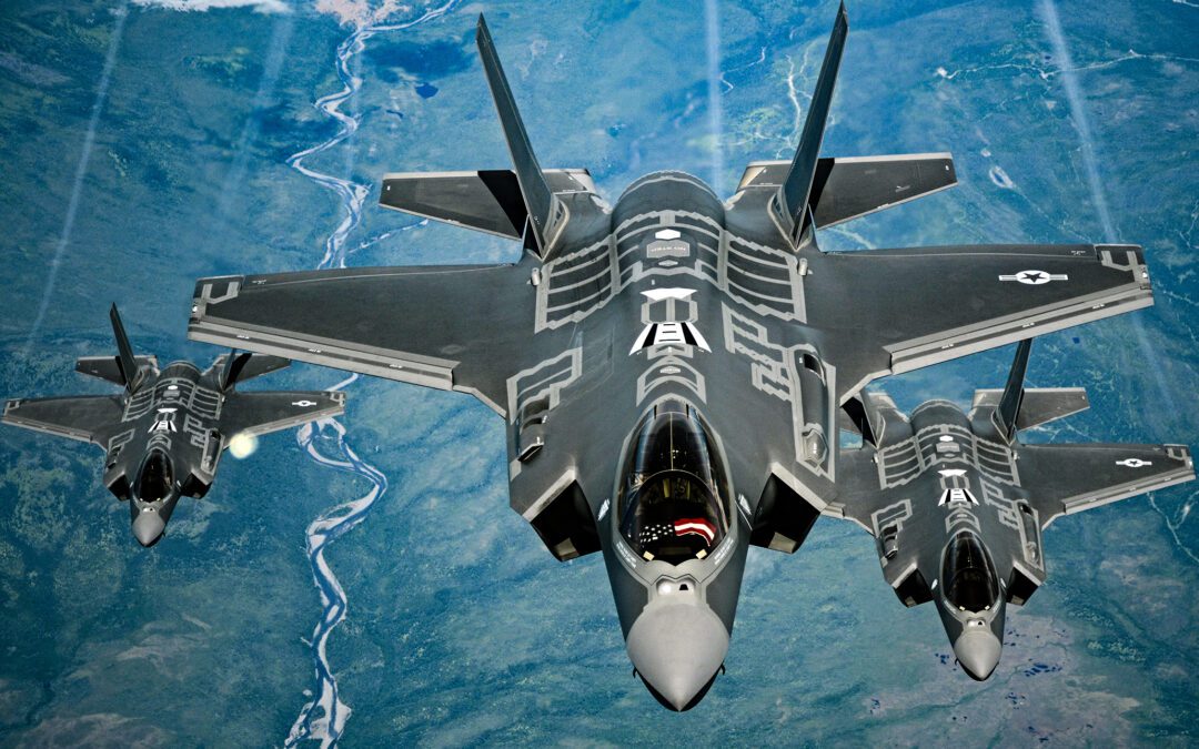 Three F-35 fighter jets flying in formation